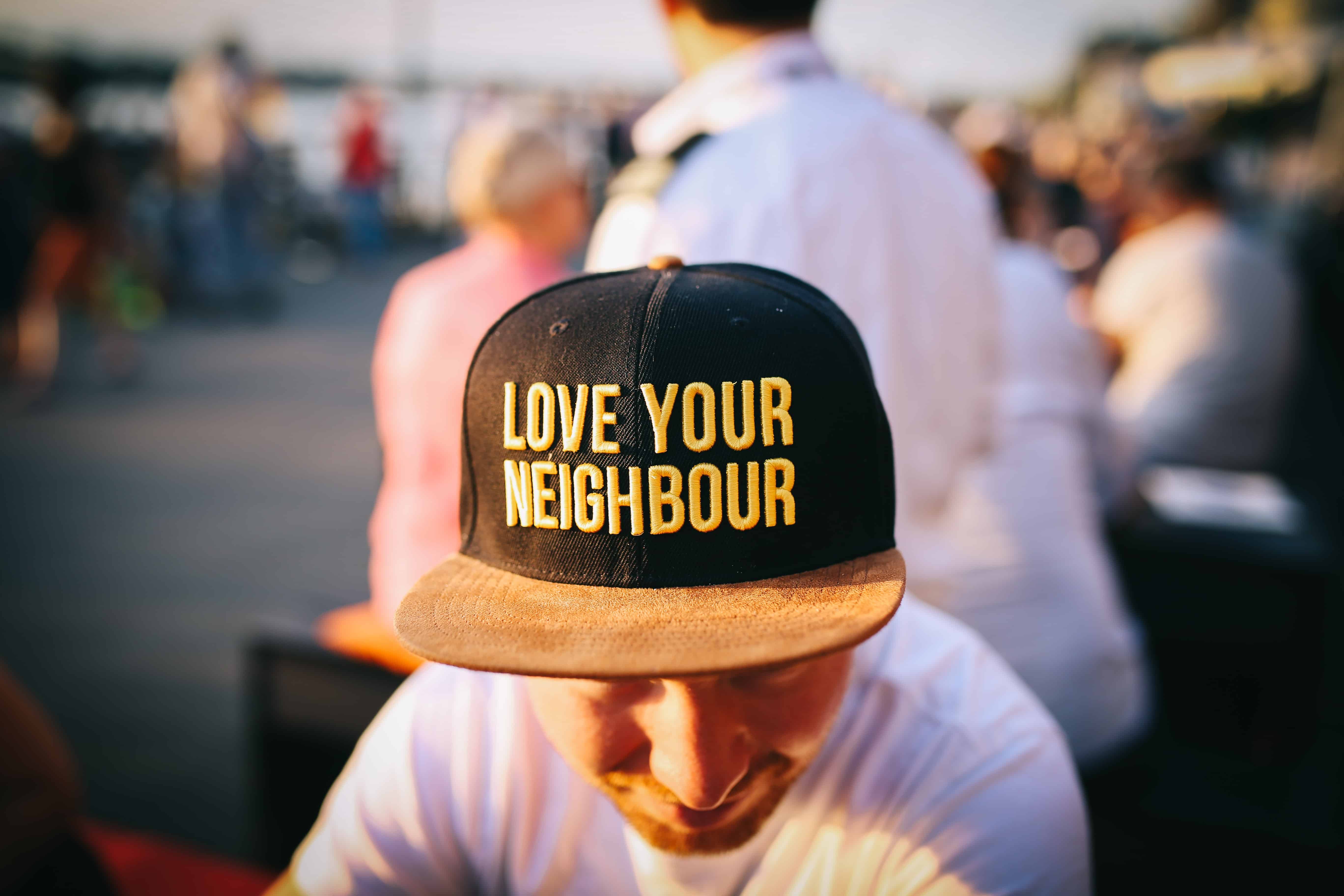 Christian wearing love your neighbor hat